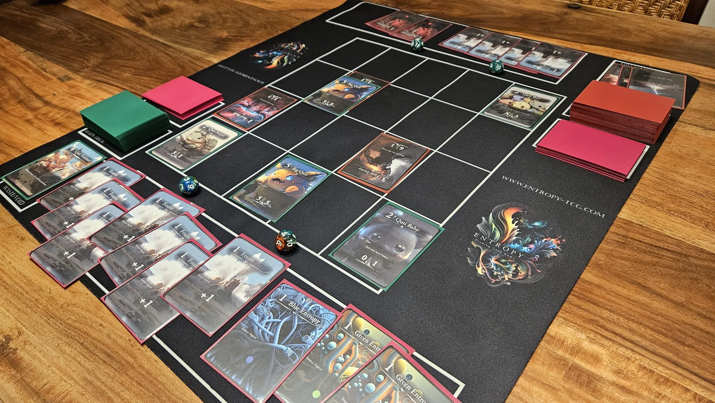 Entropy cards laid out on a playmat during a game